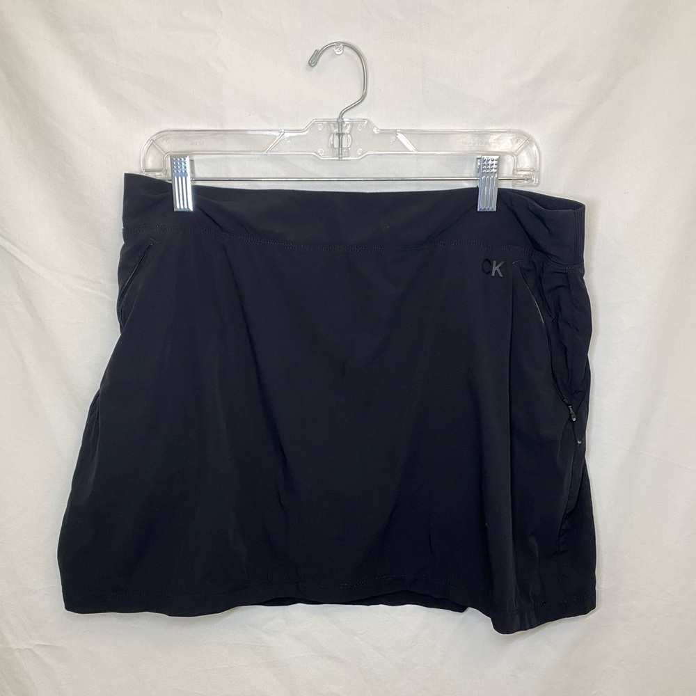 Black Calvin Klein work out skirt. Has built in shorts underneath.
